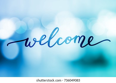 welcome vector lettering on blurred lights background