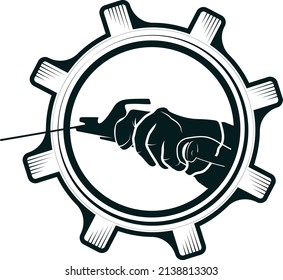 Welding machine in the hand of the welder. Symbol for welding