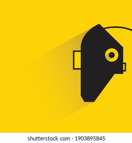 welding mask with shadow on yellow background