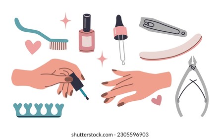 Well-groomed female hands with manicure. Hand applies nail polish. Manicure tool kit.