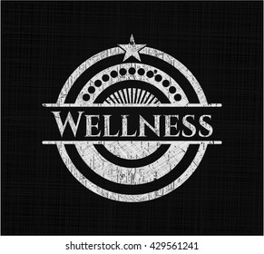 Wellness chalk emblem written on a blackboard