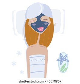 Wellness & spa: woman with facial mask. Woman with facial mask relaxing in spa.