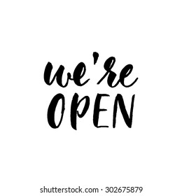 We're open, ink hand lettering. Modern brush calligraphy. Handwritten message for customers.