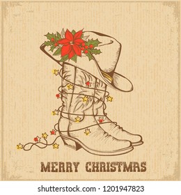 Western Christmas greeting card with cowboy traditional boots and cowboy hat on old paper background