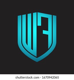 Monograma del logotipo WF con diseño de escudo de emblemas aislado con colores azules sobre fondo negro