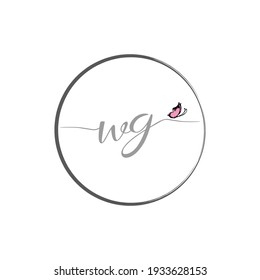 WG initial letter handwriting logo design with butterfly