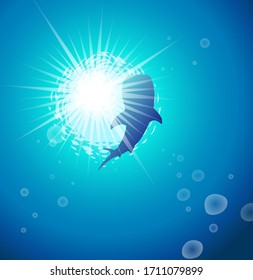 The whale shark swimming in the blue shining sea