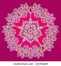 what is karma? Oriental mandala motif round lase pattern on the pink background, like snowflake or mehndi paint in red and blue