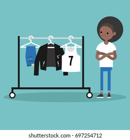 What to wear. Young concerned black girl looking at the row of clothes hanging on the open hanger. Clothes rack. Rail. Wardrobe / flat editable vector illustration, clip art