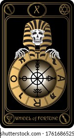 The Wheel of Fortune. The 10th card of Major arcana black and gold tarot cards. Tarot deck. Vector hand drawn illustration with skulls, occult, mystical and esoteric symbols.