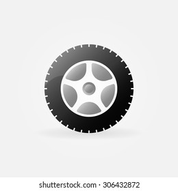 Wheel icon or logo - vector black glossy wheel or tire symbol