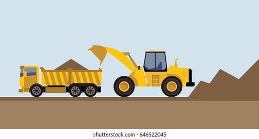 wheel loader putting soil in truck