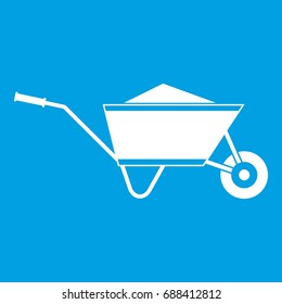 Wheelbarrow with sand icon white isolated on blue background vector illustration svg