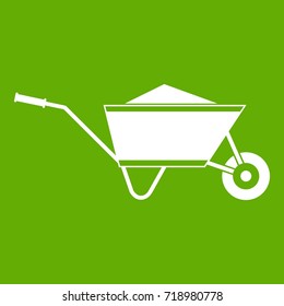 Wheelbarrow with sand icon white isolated on green background. Vector illustration svg