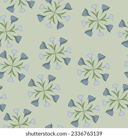 Wheels of purple lilies and their green leaves are featured on this lighter green background creating a seamless repeat pattern design.