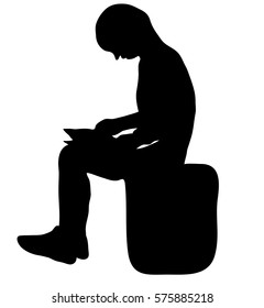 Which silhouette of a man sits reading a book