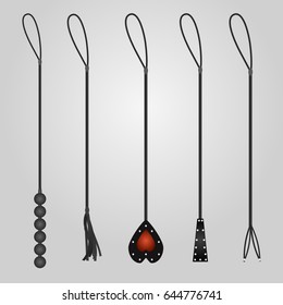 whips for BDSM on a gray background