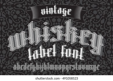 Whiskey label font and sample design with decoration and ribbon. Vintage custom gothic alphabet set, good to use for alcohol drinks labels. New modern vector gothic typeface