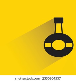whisky with shadow on yellow background