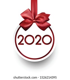 White 2020 New Year card in shape of Christmas ball with red satin bow. Greeting card or decoration. Vector paper illustration.
