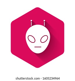 White Alien icon isolated with long shadow. Extraterrestrial alien face or head symbol. Pink hexagon button. Vector Illustration