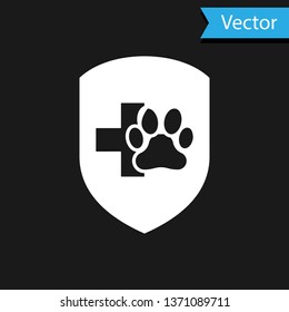 White Animal health insurance icon isolated on black background. Pet protection icon. Dog or cat paw print. Vector Illustration