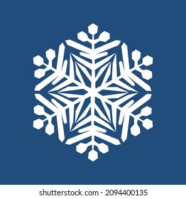 El copo de nieve de seis puntas del autor blanco sobre un fondo azul oscuro