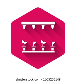 White Automatic irrigation sprinklers icon isolated with long shadow. Watering equipment. Garden element. Spray gun icon. Pink hexagon button. Vector Illustration