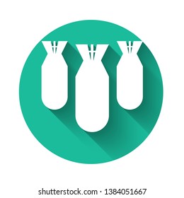 White Aviation bombs icon isolated with long shadow. Rocket bomb flies down. Green circle button. Vector Illustration