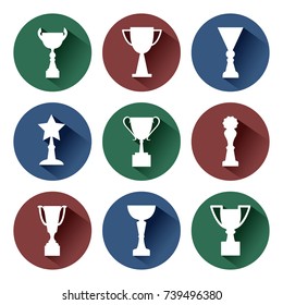 White awards and cups on red, green and blue background. Set round icons. Vector illustration