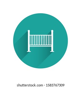 White Baby crib cradle bed icon isolated with long shadow. Green circle button. Vector Illustration