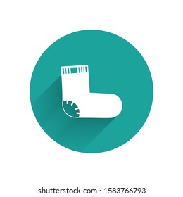 White Baby socks clothes icon isolated with long shadow. Green circle button. Vector Illustration
