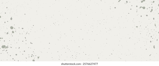 A white background with a splatter pattern. The background features a white color with gray splatters, creating a textured, artistic look. Aesthetic background vector. White background.