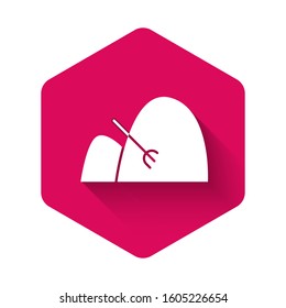 White Bale of hay and rake icon isolated with long shadow. Pink hexagon button. Vector Illustration