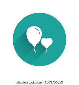 White Balloons in form of heart with ribbon icon isolated with long shadow. Green circle button. Vector Illustration