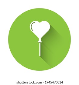 White Balloons in form of heart with ribbon icon isolated with long shadow. Green circle button. Vector