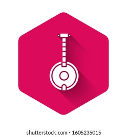 White Banjo icon isolated with long shadow. Musical instrument. Pink hexagon button. Vector Illustration