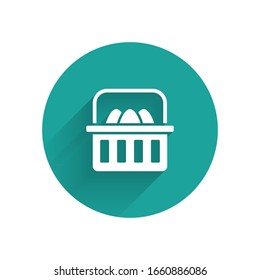 White Basket with easter eggs icon isolated with long shadow. Happy Easter. Green circle button. Vector Illustration