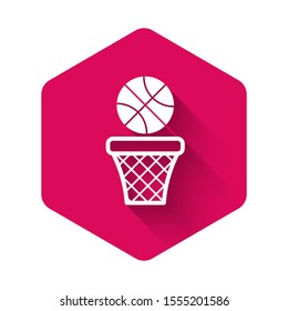 White Basketball ball and basket icon isolated with long shadow. Ball in basketball hoop. Pink hexagon button. Vector Illustration