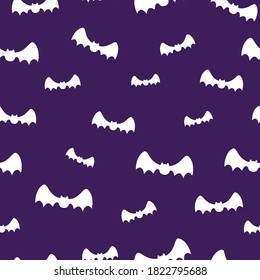 White bat silhouette on purple background seamless pattern. Cute little character illustration. Halloween festival. Decoration and pattern.