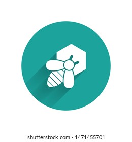 White Bee and honeycomb icon isolated with long shadow. Honey cells. Honeybee or apis with wings symbol. Flying insect. Sweet natural food. Green circle button. Vector Illustration
