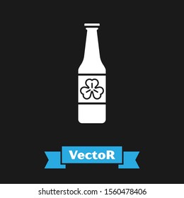 White Beer bottle with four leaf clover icon isolated on black background. Happy Saint Patricks day.  Vector Illustration