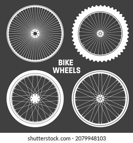 White bicycle wheel symbols collection. Bike rubber tyre silhouettes. Fitness cycle, road and mountain bike. Vector illustration.