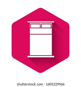 White Big bed for two or one person icon isolated with long shadow. Pink hexagon button. Vector Illustration