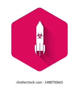 White Biohazard rocket icon isolated with long shadow. Rocket bomb flies down. Pink hexagon button. Vector Illustration