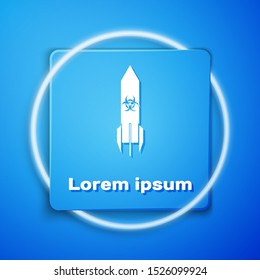 White Biohazard rocket icon isolated on blue background. Rocket bomb flies down. Blue square button. Vector Illustration