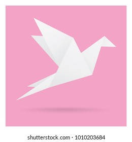 white bird paper craft flying in frame art isolated on pink background