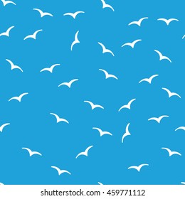 White birds on a blue background. Vector seamless pattern on a white background. Marine theme. 