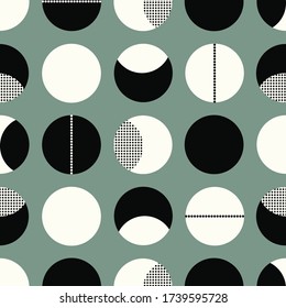 White and black circles. Green background. Seamless pattern.