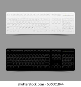 White and black computer keyboard with shadow on gray background